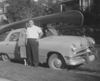 Couple with Canoe on Car